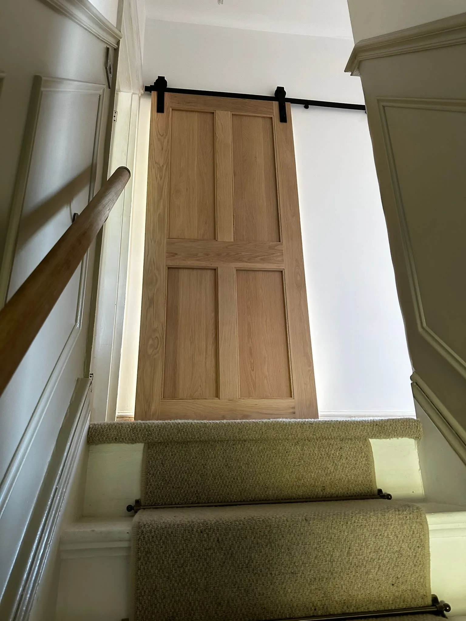 a wooden door sitting on top of a set of stairs