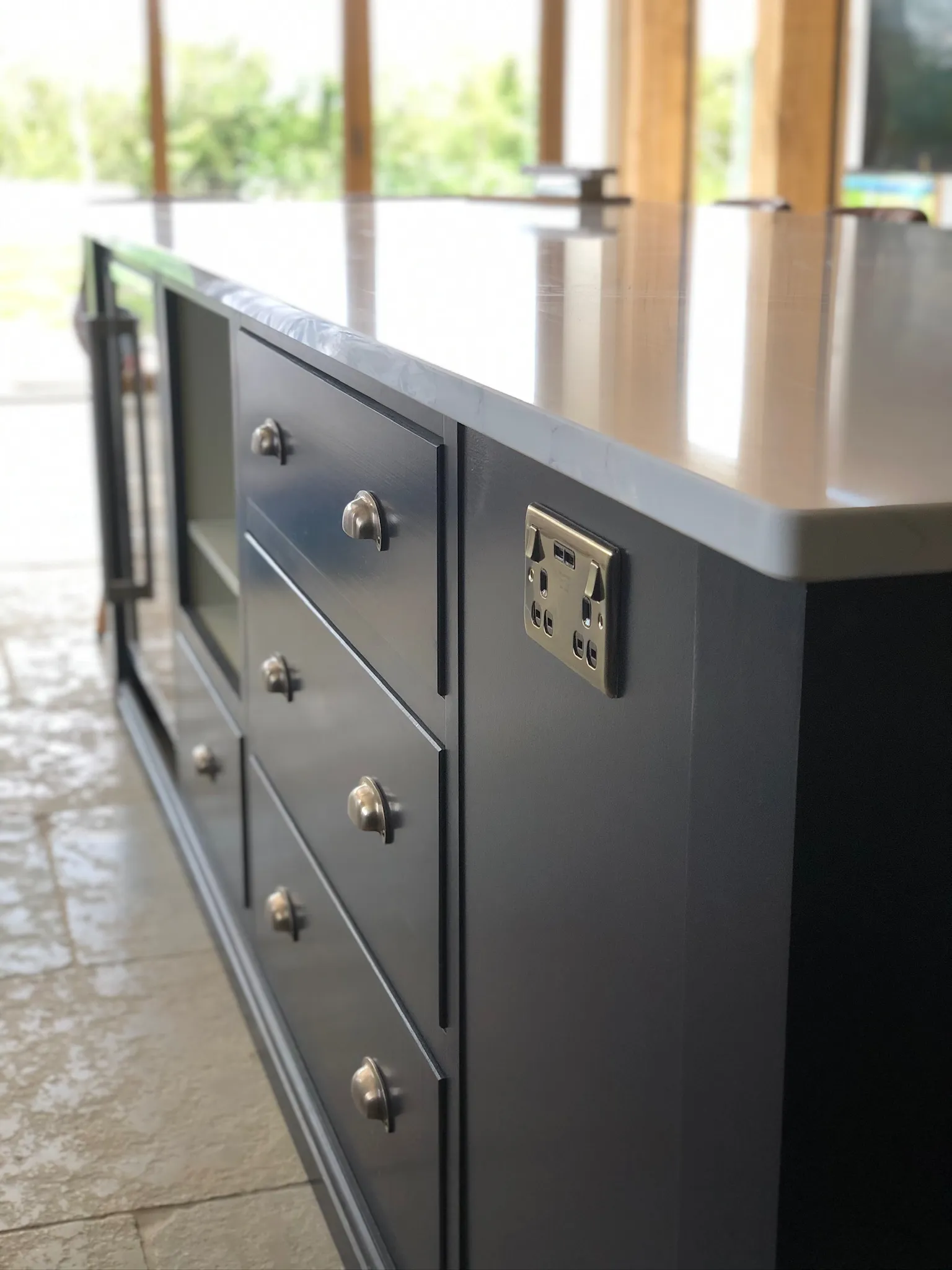 A close up of a dresser with a clock on it.