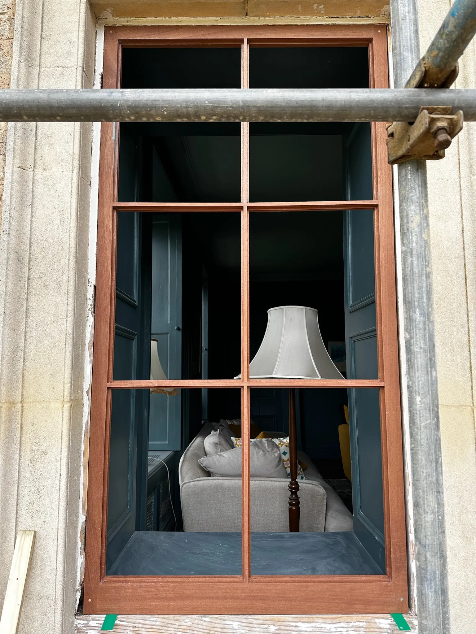 A lamp sitting on top of a window sill.